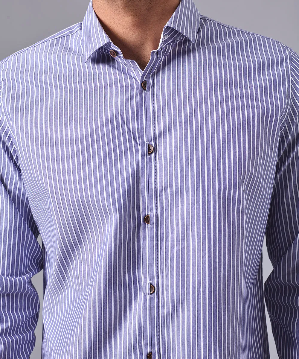 CAMISA MANGA LARGA PECHERA OJAL CLASSIC FIT AZUL C/RAYAS OI24